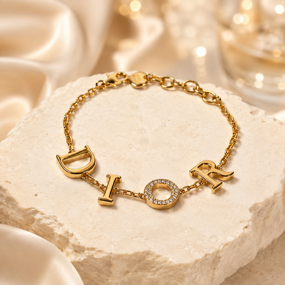 Luxury designer-inspired gold charm statement bracelet from 876Luxe
